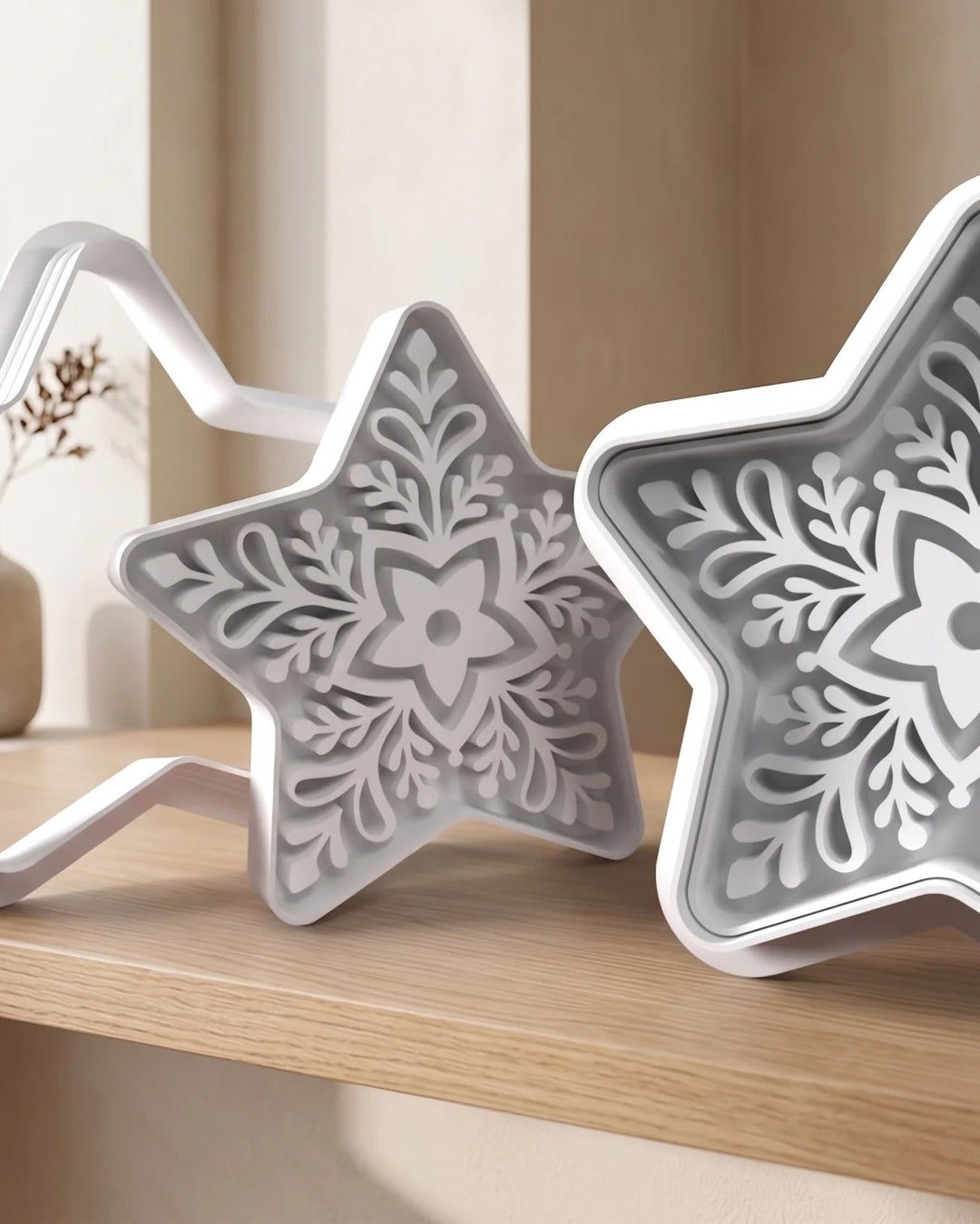 Cookie cutter shaped like a Christmas star with detailed embossing.
