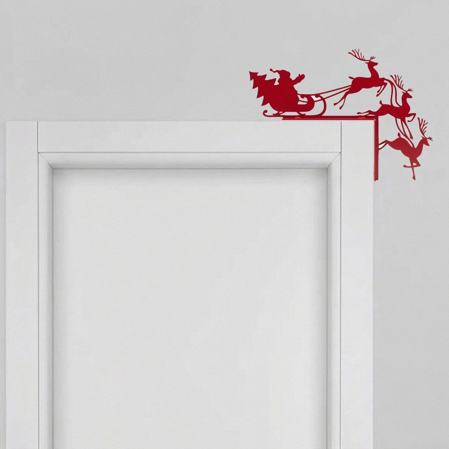 Silueta decorativa de Santa Claus y renos en color rojo mate diseñada para esquinas de puertas y marcos.