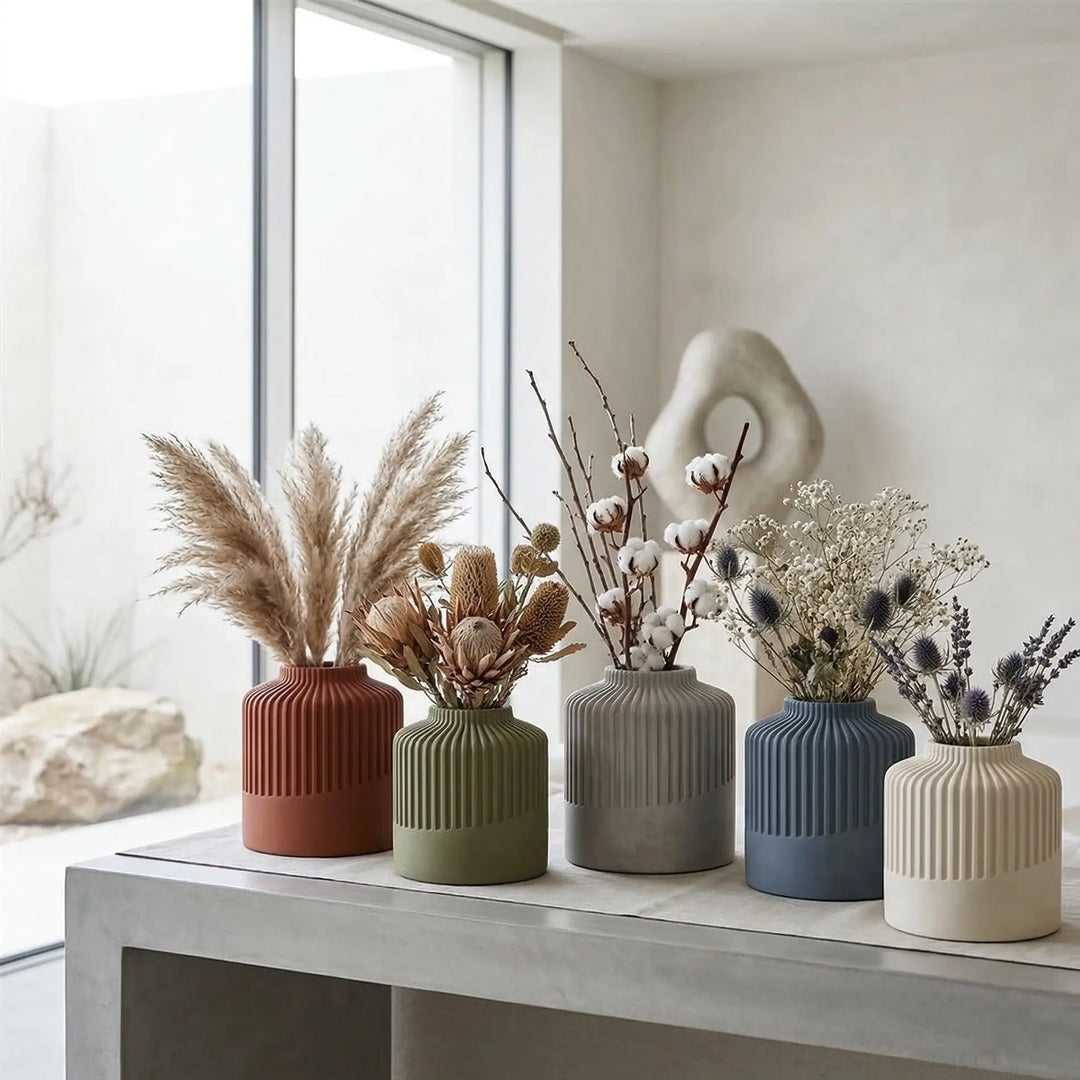 Contemporary design vase with a ribbed top texture and smooth base in a matte finish for premium home decor.